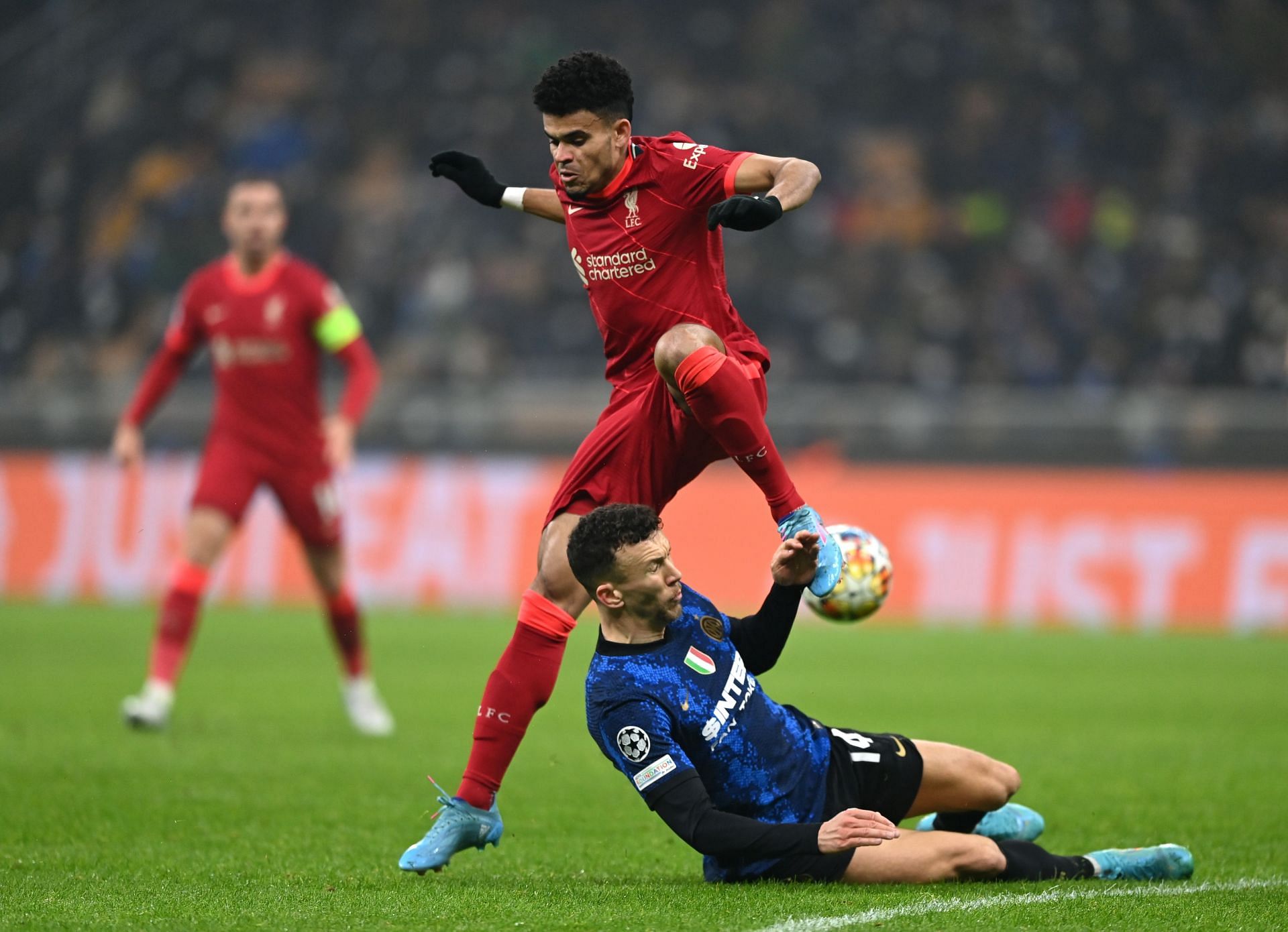 Liverpool's Luis Diaz (in red) is tackled by Inter Milan's Ivan Persisic